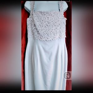 NWT New w/ tags still on shiny silver periwinkle formal dress from Belsoie. 14w.